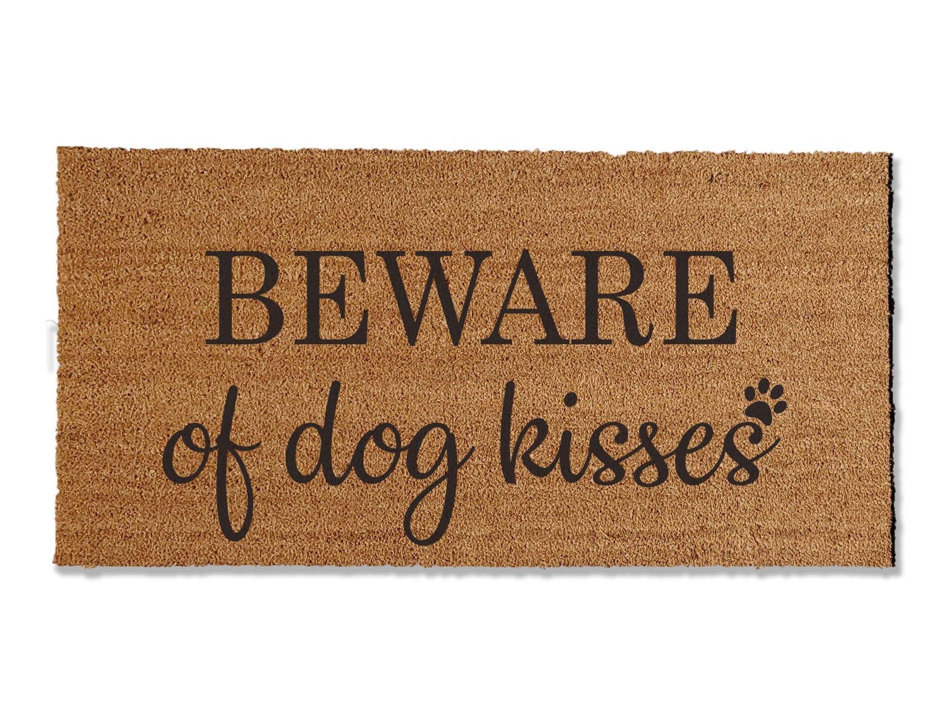 Half-inch thick coir doormat featuring a fun hearted message: 'Beware of Dog Kisses.' The mat is made of durable coir fibers, perfect for both function and charm at your entrance.