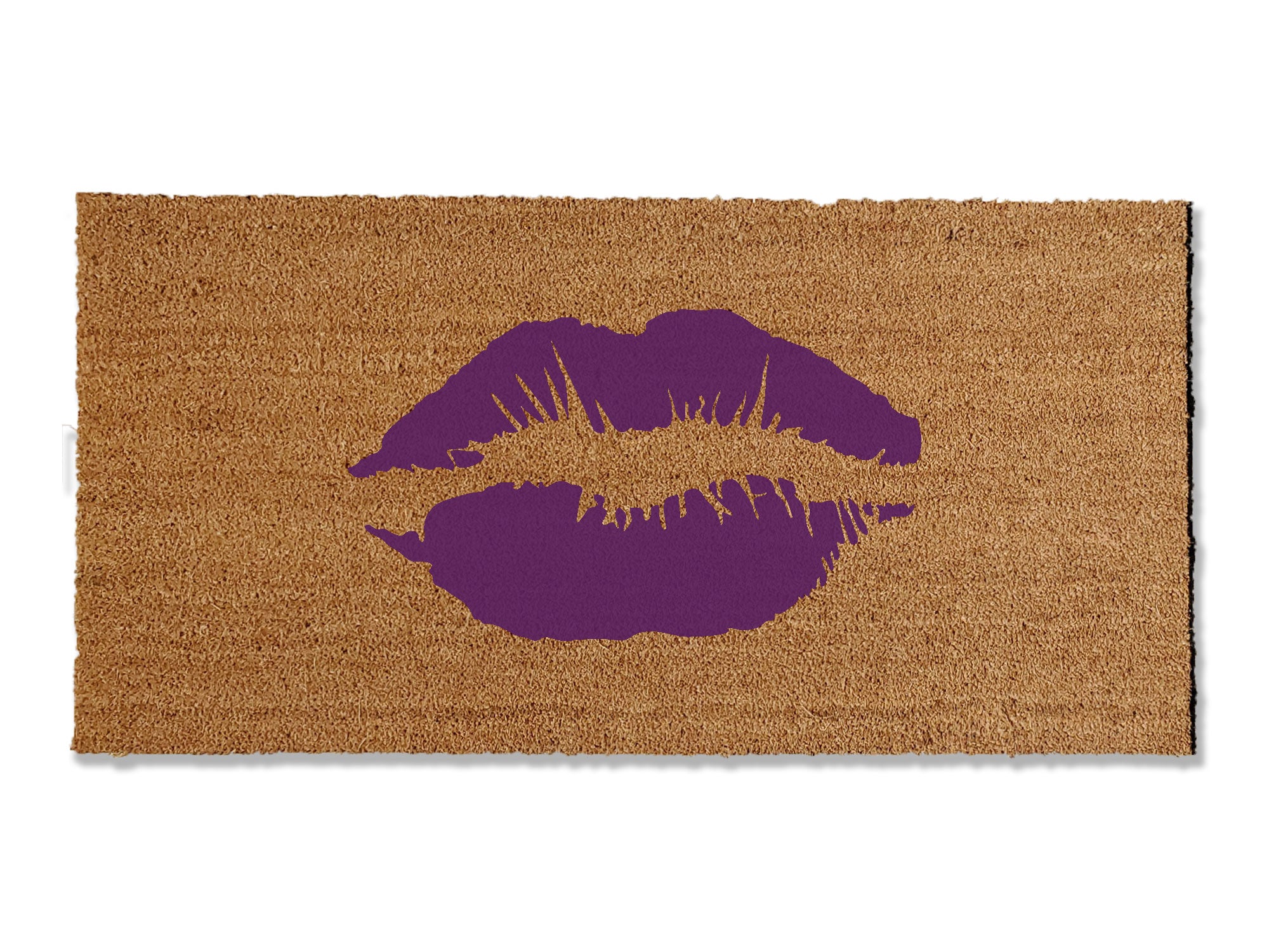Make a chic statement with our coir doormat featuring a playful lipstick smooch. Available in multiple colors and sizes, this trendy mat adds a touch of glamour to your doorstep. Beyond style, it excels at trapping dirt, making it a functional and fashionable addition to your entryway.