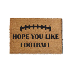 Introduce football spirit to your entryway with our 1/2-inch thick coir doormat, featuring the message 'Hope your like football.' Ideal for welcoming guests during the football season, this versatile mat is available in multiple sizes, providing a perfect blend of style and functionality for your home's entrance.