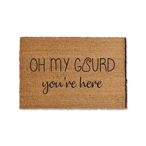 Welcome fall with our seasonal doormat saying 'Oh my gourd, you're here.' The perfect addition to your entryway, this whimsical mat is sure to bring a smile to guests' faces. Embrace the autumn spirit with a touch of humor, creating a warm and inviting atmosphere at your doorstep.