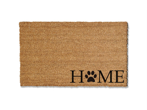 Transform your entryway with our charming coir doormat, featuring the word 'Home' with a paw print replacing the 'o' in the bottom right corner. Perfect for welcoming guests to your dog-friendly home, this unique mat not only adds a personal touch but also helps keep dirt at bay, ensuring a clean and inviting space.