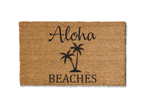 18 inches by 30 inches coir doormat with graphic printed onto the doormat. Aloha Beaches with palm trees.