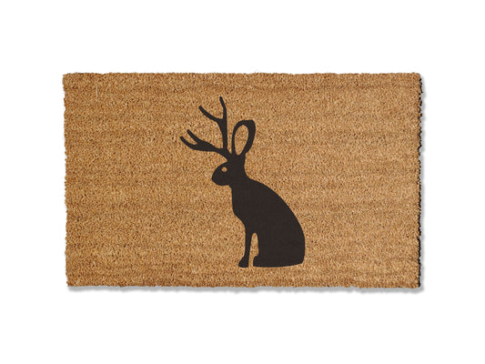 Welcome guests with our coir welcome doormat, featuring a design of the mystical jackalope. Available in multiple sizes, this is the perfect gift for jackalope lovers, adding a touch of canine charm that effortlessly spruces up your entryway.