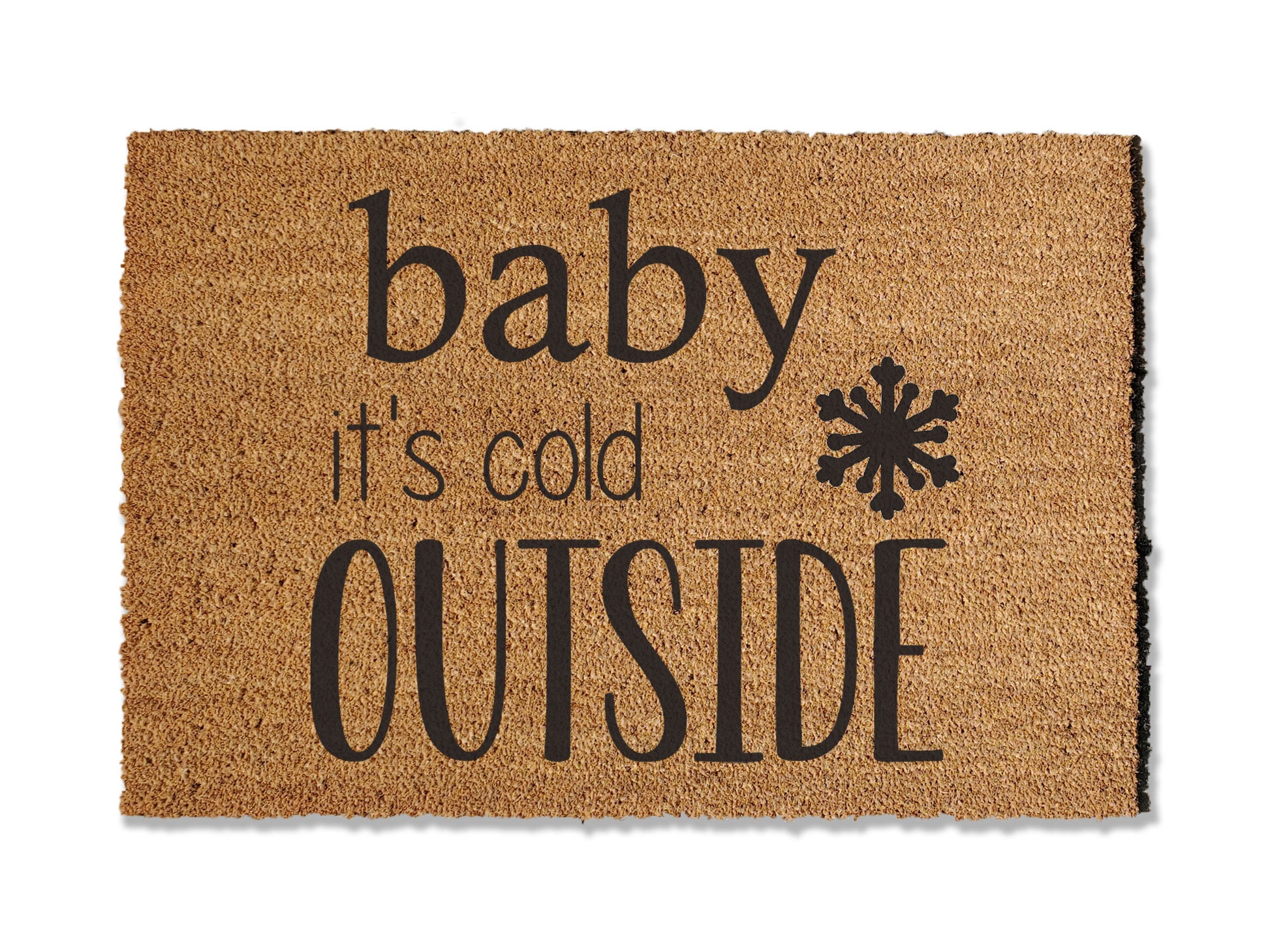 A coir doormat that is 24 inches by 36 inches and has a the text baby it's cold outside with a snowflake painted on it.