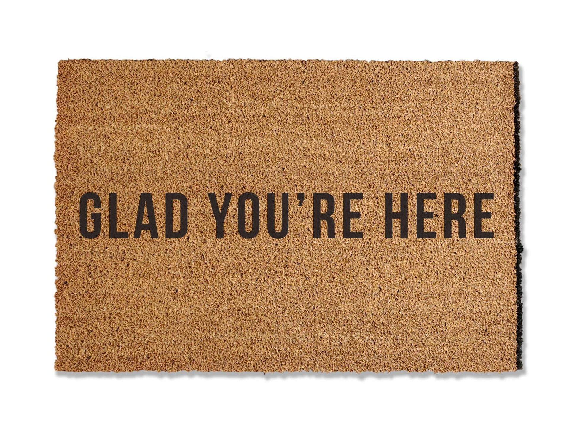 Extend a warm welcome with our 'GLAD YOU'RE HERE' coir doormat, available in various sizes. Perfect for both function and style, this charming mat invites guests into your home while effectively keeping dirt at bay. Choose the ideal size to enhance your entryway.