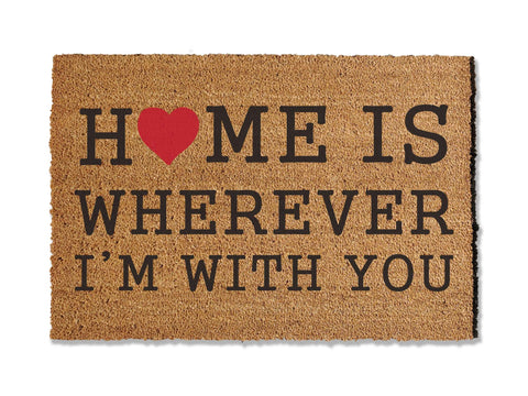Add warmth to your entryway with our coir doormat bearing the phrase 'Home is Wherever I'm With You.' This sentiment serves as a heartfelt reminder of what truly matters, all while effectively keeping dirt at bay. Welcome guests with this charming and meaningful addition to your home.