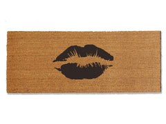 Make a chic statement with our coir doormat featuring a playful lipstick smooch. Available in multiple colors and sizes, this trendy mat adds a touch of glamour to your doorstep. Beyond style, it excels at trapping dirt, making it a functional and fashionable addition to your entryway.