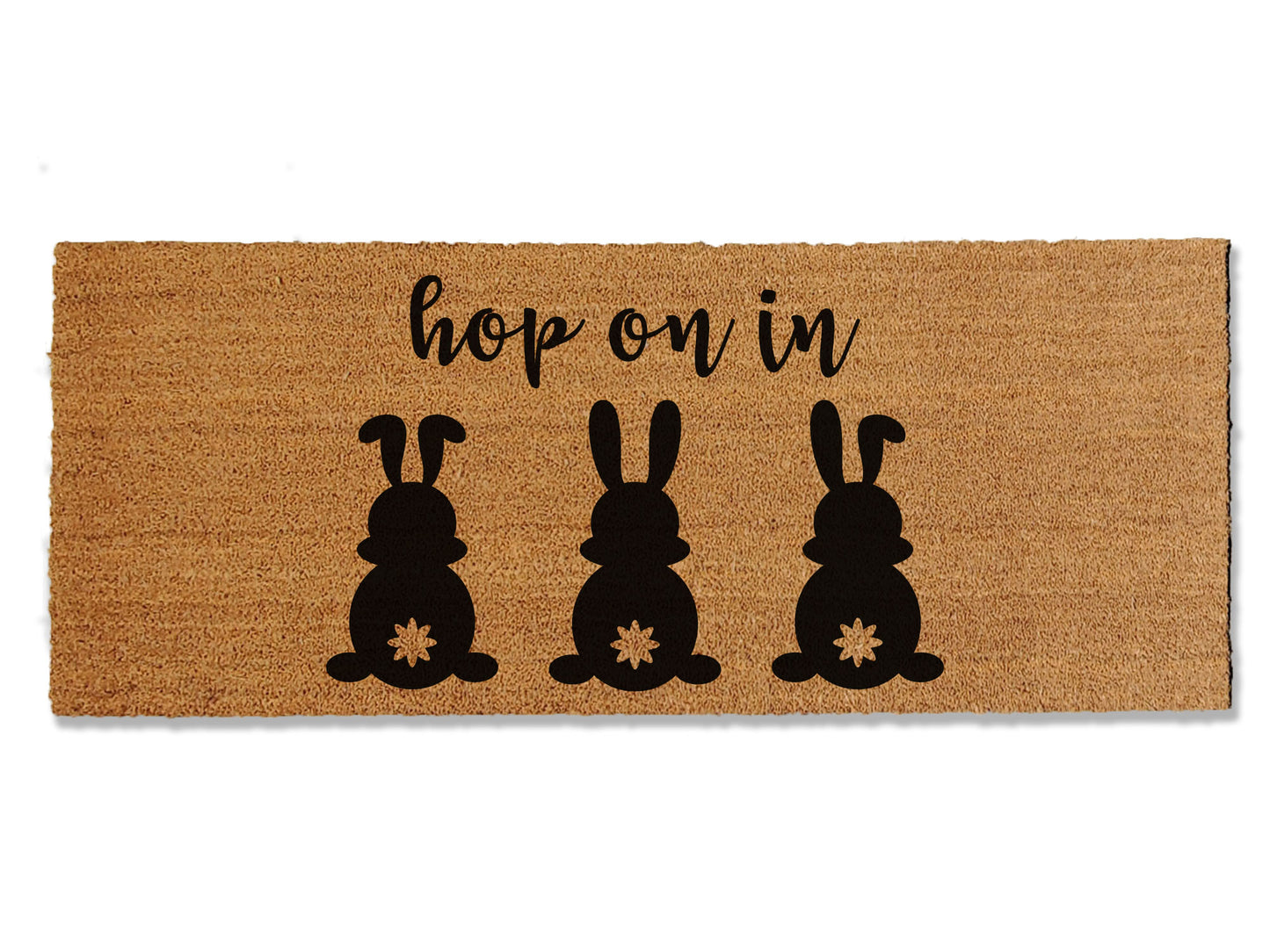 Welcome guests with our festive seasonal coir doormat, saying 'Hop on In' and featuring three adorable bunnies. The perfect way to greet guests this Easter, this mat not only adds a touch of holiday cheer but also excels at trapping dirt to keep it from entering your home.