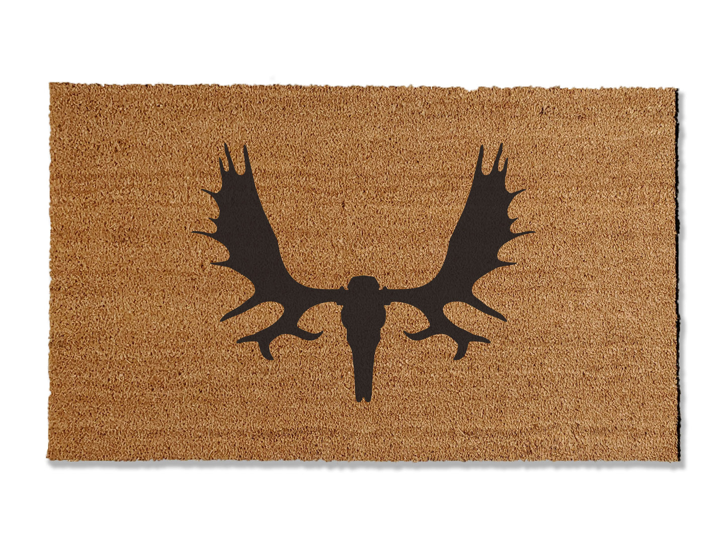 Add a rustic touch to your home or cabin entrance with our coir doormat featuring a moose skull design. Perfect for those seeking a rustic aesthetic, this unique mat is available in multiple sizes. Beyond its distinctive appearance, it excels at trapping dirt, making it a practical and stylish addition to enhance your entryway.